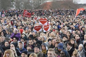 Protesters rally against racism during a demonstration in the Stockholm suburb of Karrtorp