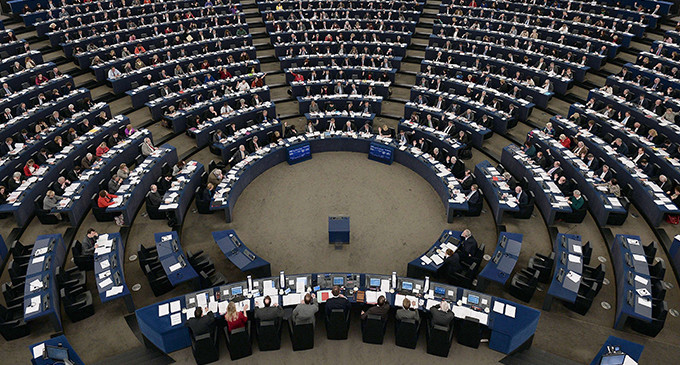 Members of the EU Parliament take part in a vote during a plenary session at the European Parliament in Strasbourg, eastern France, on January 14, 2014. AFP PHOTO / FREDERICK FLORIN