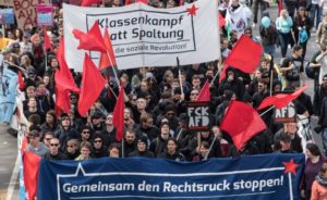STG206. Stuttgart (Germany), 30/04/2016.- People hold banners reading 'Together we stop the move to the right' and 'Class war instead of division; as thousands of demonstrators take part in a protest in Stuttgart, Germany, 30 April 2016 against the right-wing conservative Alternative for Germany (AfD) who are holding their party national convention the city. Reports state that left wing protestors demonstrated outside the venue with the aim of stopping people attending the conference. German right-wing anti-migration Alternative for Germany (AfD) has recently come under criticism for remarks about the Islam. (Protestas, Alemania) EFE/EPA/DANIEL MAURER