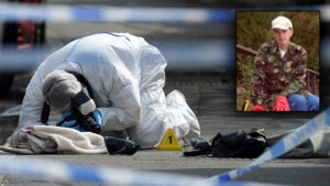 A police forensic officer works at the scene where a coat, shoe and handbag lie on the pavement outside the library in Birstall where Labour MP Jo Cox was shot on June 16, 2016.Campaigning for Britain's EU referendum next week was suspended on July 16 following news a leading MP with the "Remain" camp was in a critical condition after being shot. Jo Cox, a 41-year-old mother-of-two from the opposition Labour Party, was left bleeding on the pavement after the incident in the town of Birstall in northern England, according to witnesses quoted by local media. / AFP / OLI SCARFF (Photo credit should read OLI SCARFF/AFP/Getty Images)